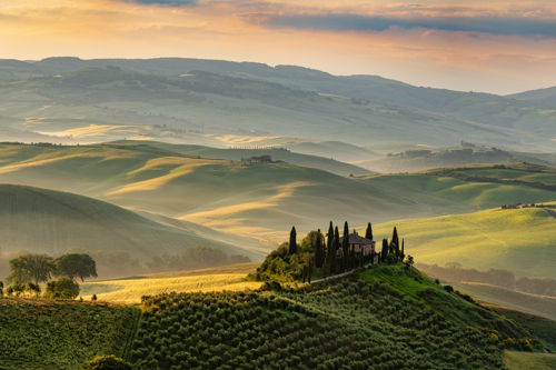 Sustainable Luxury Tourism – How the World’s Countryside Is Reinventing Hospitality Olive groves and rolling hills at sunset – symbol of sustainable luxury and rural hospitality